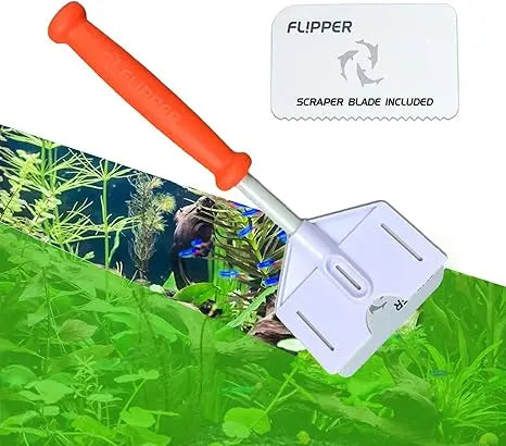 Aquarium cleaning tool with orange handle and white scrubber head on a green aquatic background.