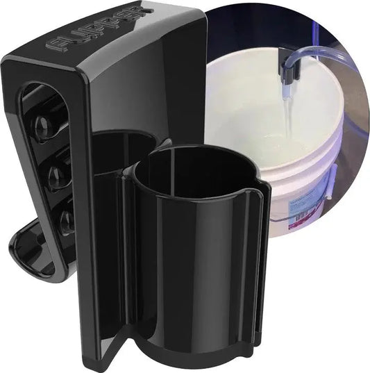 Flipper Bucket Buddy clipping aquarium hose securely to a bucket during a water change