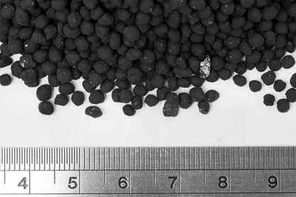 UNS Controsoil Black Normal aquasoil granules shown next to a ruler for scale