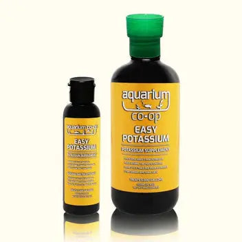 Aquarium hobbyist dosing Aquarium Co-Op Easy Potassium fertilizer into a planted freshwater tank with lush green aquatic plants.